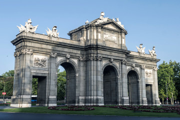 Fototapeta na wymiar Alcala Gate or Puerta de Alcala is a monument in the Plaza de la Independencia in Madrid, Spain