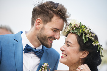 Young couple in a wedding ceremony at the beach