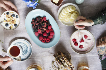 Breakfast table with yoghurt and fresh berries