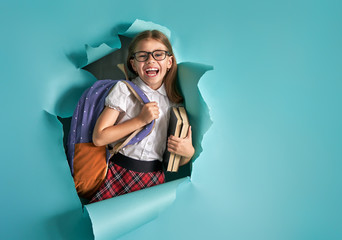 child breaking through color wall