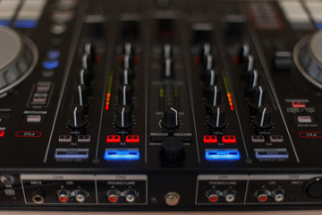 Audio controller. Mixer for DJ