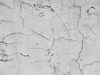 white cement wall with cracks