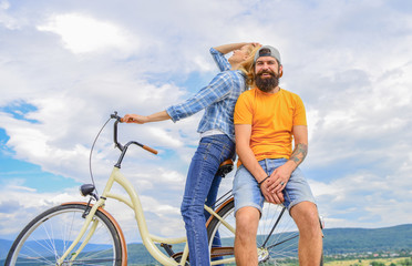 Bike rental or bike hire for short periods of time. Date ideas. Couple with bicycle romantic date sky background. Man and woman rent bike to discover city. Couple in love date outdoors cycling