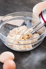 MIxing baking ingredients in a bowl for cake or pancakes. Food photography styling concept