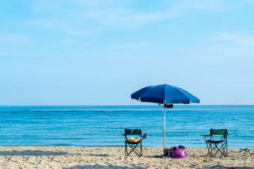Fototapeta na wymiar Beach umbrella near the sea