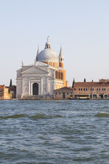 Fototapeta na wymiar Redentore church dedicated to Christ the Redeemer , Venice, Italy on the Giudecca Canal at sunset, Designed by Palladio