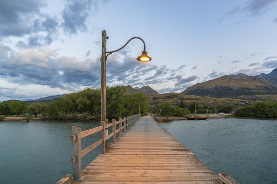 The jetty with lamp post at dusk. Glenorchy, Queenstown Lake district, Otago region, South Island, New Zealand.