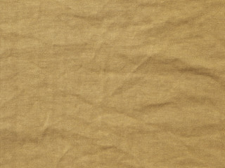 crumpled brown fabric texture background, material of textile industrial
