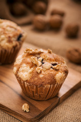 Tasty homemade walnut muffins on table. Sweet pastries