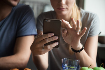 Woman holding mobile phone using smartphone apps concept, couple customers shopping, texting...