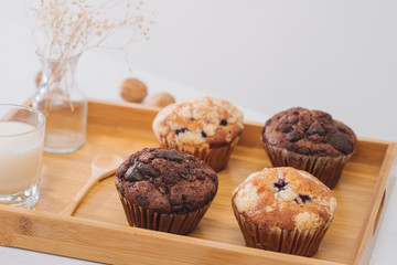 Breakfast with fresh homemade delicious muffins and milk.