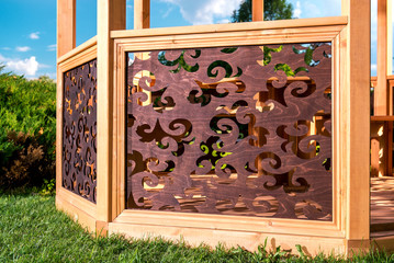 Outdoors wooden carved gazebo