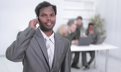 Fototapeta premium portrait of a successful employee with a mobile phone