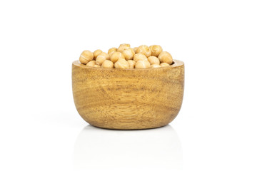 Lot of whole raw chickpeas kabuli variety with wooden bowl isolated on white background