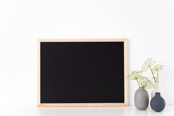 Chalk board landscape mock up with a host in vases. Mockup for headline, design. Template for businesses, bloggers,media
