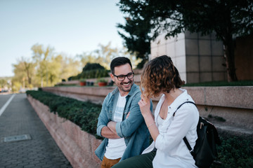 Fototapeta premium Cute young couple talking in the city.