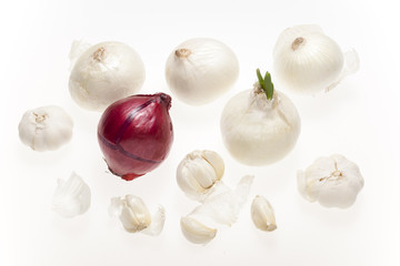 fresh garlic and onion with flakes isolated on white