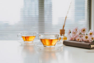 cup of herbal tea with chamomile flowers