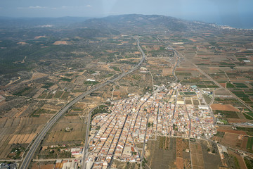 Areal view from airplane of Cabanas village in Valencia region. 