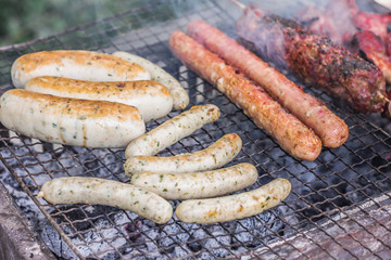 Fried sausages on the grill. B-B-Q