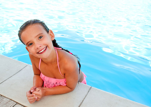 Cute smiling happy little girl child  in swimming pool