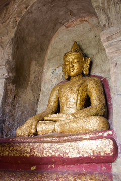 Buddha statue painted in gold and covered by golden paper