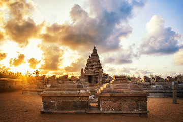 Photo shot on sunrise time where the historical buildings of Mamallapuram monuments are...