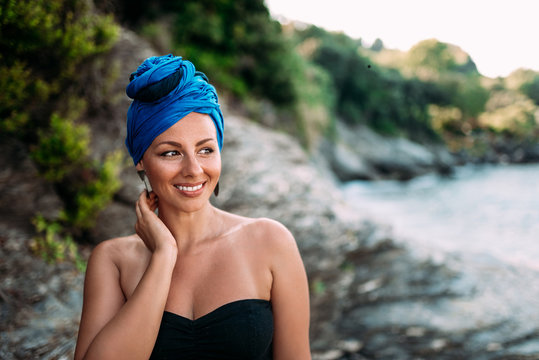 Close-up Image Of Beautiful Woman With Headscarf And Genuine Smile Outdoors. Summertime Vacation Concept.