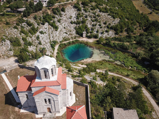 Fototapeta na wymiar The spring of the Cetina River (izvor Cetine) in the foothills of the Dinara Mountain is named Blue Eye (Modro oko). Cristal clear waters emerge on the surface from a more than 100 meter-deep cave.