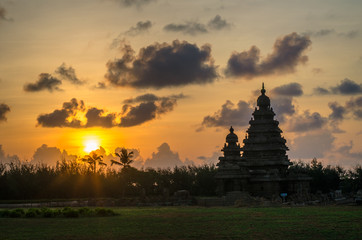 Photo shot on sunrise time where the historical buildings of Mamallapuram monuments are highlighted. 