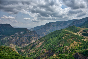 Mountain landscape with clouds and grass