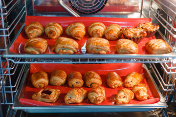 French sweet pastries in a professional oven - 216825324