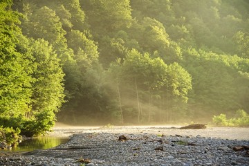 Dawn over a mountain river