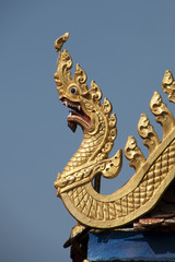 Fototapeta na wymiar Battambang Cambodia, golden dragon roof carving at Wat Kandal 