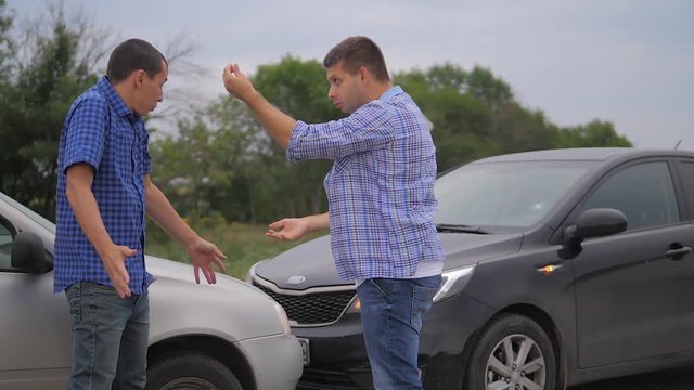 Two men arguing conflict after a car accident on the road car insurance. slow motion video. Two Drivers man Arguing After lifestyle Traffic Accident. auto insurance accident concept men. Two men