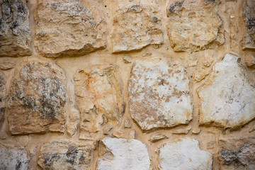 Wall of stones of different shapes of light shades