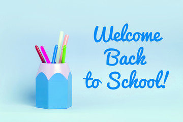 Mock up picture of notebook and office supplies, pencil holder on blue background.