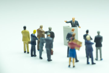 Politician or businessman gives speech to his subordinates.