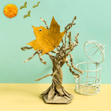 Dry maple leaf as bird flew out of cage. Photographic story, part 3