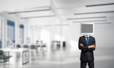 Businessman with monitor instead of head.