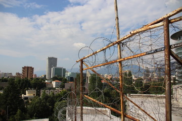 Fototapeta premium View of Tirana through barbed wire