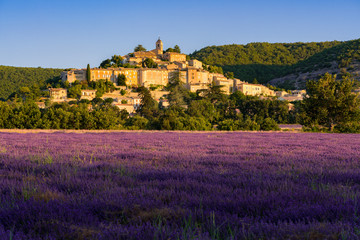 The village of Banon in Provence with lavender fields at sunrise. Summer in the...