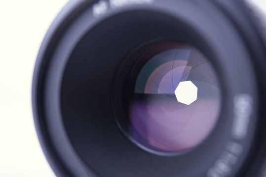 closeup camera shutter lens on white background.