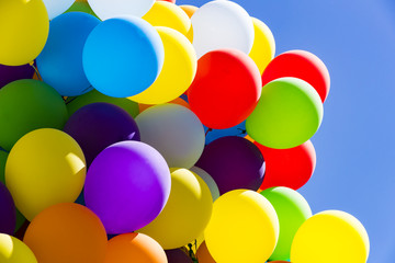 Background of a set of colored balloons on the sky background