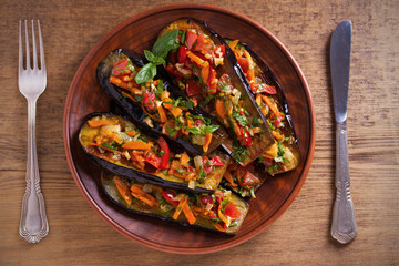 Eggplants with tomatoes, paprika, carrot, onion and garlic. Aubergine with vegetables. overhead, horizontal