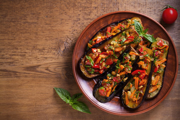 Eggplants with tomatoes, paprika, carrot, onion and garlic. Aubergine with vegetables. overhead, horizontal