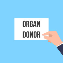 Man showing paper ORGAN DONOR text