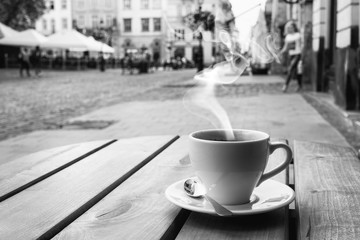 cup of coffe on the table of the outdoor cafe on the italian sidewalk. - 216834508