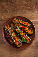 Eggplants with tomatoes, paprika, carrot, onion and garlic. Aubergine with vegetables. overhead, horizontal