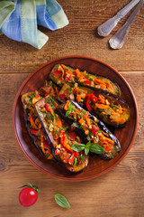 Eggplants with tomatoes, paprika, carrot, onion and garlic. Aubergine with vegetables. overhead, horizontal